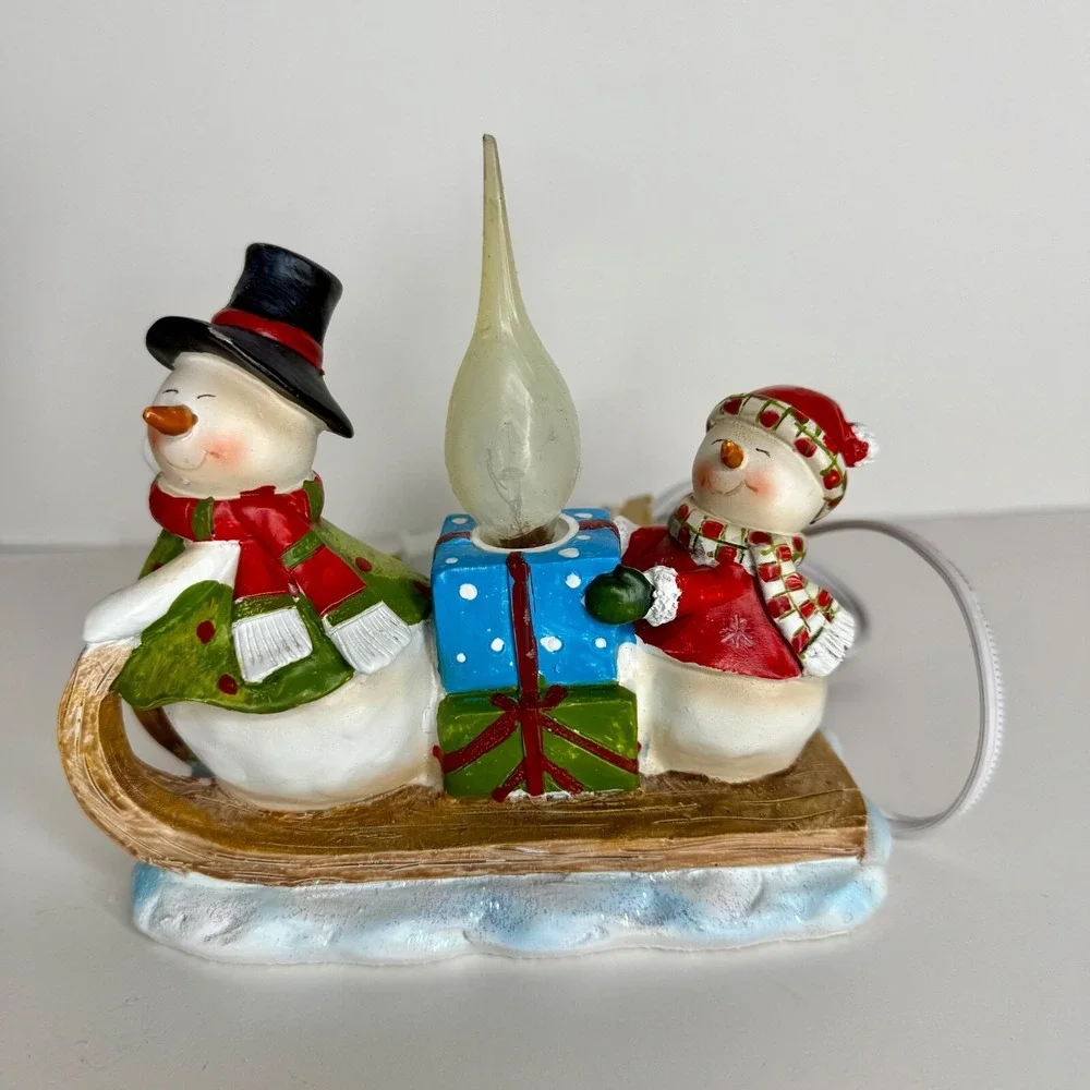 Sledding snowman and woman night light, winter light, snowman light